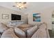 Cozy living room featuring a TV, neutral decor, and comfortable seating, ideal for a relaxing evening at home at 1250 E Canyon Creek Dr, Gilbert, AZ 85295