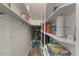 Walk in pantry with ample storage space features open shelving and tile floors at 1250 E Canyon Creek Dr, Gilbert, AZ 85295