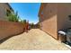 Functional side yard with gravel and block wall featuring space for storage or other outdoor use at 1250 E Canyon Creek Dr, Gilbert, AZ 85295