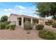 Backyard features desert landscaping, a covered patio, and is fully fenced at 13414 W San Pablo Dr, Sun City West, AZ 85375