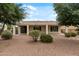 Backyard patio features landscaped desert and greenery at 13414 W San Pablo Dr, Sun City West, AZ 85375
