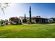 Beautiful clubhouse features a well-manicured lawn and attractive landscaping, creating an inviting space at 13414 W San Pablo Dr, Sun City West, AZ 85375