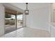 Inviting dining area with tiled floors and large windows offering backyard views at 13414 W San Pablo Dr, Sun City West, AZ 85375