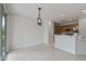 Open dining space with tile floors, recessed lighting, and view to the kitchen at 13414 W San Pablo Dr, Sun City West, AZ 85375