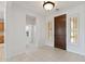 Spacious entryway with a view of the hallway and bathroom, adjacent to the front door at 13414 W San Pablo Dr, Sun City West, AZ 85375