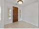 Bright entryway showcasing a beautiful front door and tile flooring, creating a welcoming first impression at 13414 W San Pablo Dr, Sun City West, AZ 85375