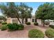 Beautiful single-story home with desert landscaping, a two-car garage, and mature shade trees, offering a serene setting at 13414 W San Pablo Dr, Sun City West, AZ 85375