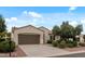 Well-maintained single-story home with desert landscaping, spacious driveway, and a neatly kept front yard at 13414 W San Pablo Dr, Sun City West, AZ 85375