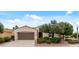 Welcoming single-story home featuring desert landscaping, a two-car garage, and a charming street lamp at 13414 W San Pablo Dr, Sun City West, AZ 85375