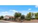 Charming single-story home with desert landscaping and a black metal fence surrounding the well-manicured front yard at 13414 W San Pablo Dr, Sun City West, AZ 85375