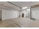 Garage features ample storage along the wall and ceiling at 13414 W San Pablo Dr, Sun City West, AZ 85375