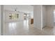 Open living space with tile flooring, ceiling fan, and views to the yard through shuttered windows at 13414 W San Pablo Dr, Sun City West, AZ 85375