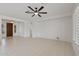 Large, open living space with tile floors, a ceiling fan, and a view of the entryway at 13414 W San Pablo Dr, Sun City West, AZ 85375