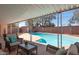 Inviting covered patio overlooking a sparkling pool and lush backyard landscaping at 1413 W 7Th Pl, Tempe, AZ 85281