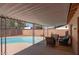 Covered patio with furniture overlooking a private pool and fenced backyard at 1413 W 7Th Pl, Tempe, AZ 85281