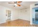Open-concept living room with wood-look floors and view into the bath, maximizing the space at 1413 W 7Th Pl, Tempe, AZ 85281