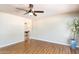 Spacious living room featuring wood-look floors and a view into the next room at 1413 W 7Th Pl, Tempe, AZ 85281