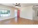 Bright living room with wood-look floors and a red front door, creating an inviting space at 1413 W 7Th Pl, Tempe, AZ 85281