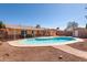 Relaxing backyard featuring a sparkling in-ground pool and covered patio, ideal for outdoor living at 1413 W 7Th Pl, Tempe, AZ 85281