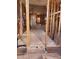 Stripped-down interior view showcasing exposed framing, potential for customized renovation with abundant natural light at 1416 E Southern Ave, Apache Junction, AZ 85119