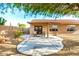 Backyard with desert landscaping, concrete patio and covered seating area perfect for outdoor living at 1492 E Westchester Dr, Chandler, AZ 85249