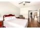 Bedroom with laminate flooring, ceiling fan, and a connected bonus room at 1492 E Westchester Dr, Chandler, AZ 85249