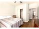Bedroom features wood floor, closet and neutral colored walls at 1492 E Westchester Dr, Chandler, AZ 85249