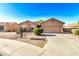 Single-Gathering house with a xeriscaped front yard, two-car garage and neutral color scheme at 1492 E Westchester Dr, Chandler, AZ 85249