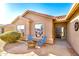 Welcoming front entrance with tile patio featuring seating and well maintained desert landscaping at 1492 E Westchester Dr, Chandler, AZ 85249