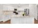 Modern kitchen with white cabinets, stainless steel appliances, and granite countertops with an island at 1492 E Westchester Dr, Chandler, AZ 85249