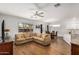 Open living room and dining room space with laminate floors and natural light at 1492 E Westchester Dr, Chandler, AZ 85249