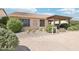 Backyard with drought resistant plants and covered patio at 16165 W Vale Dr, Goodyear, AZ 85395
