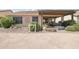 Backyard featuring desert landscaping and a covered patio at 16165 W Vale Dr, Goodyear, AZ 85395