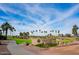 Welcome to PebbleCreek, a Robson Resort Community, showcasing its lush landscapes, lake, and inviting entrance sign at 16165 W Vale Dr, Goodyear, AZ 85395
