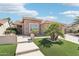 Attractive single-story home showcasing desert landscaping and an inviting walkway at 16165 W Vale Dr, Goodyear, AZ 85395