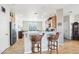 Open kitchen with a breakfast bar, stainless steel appliances, and adjacent dining area at 16165 W Vale Dr, Goodyear, AZ 85395