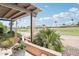 View from covered patio, showcasing lush landscaping and golf course in a desirable community at 16165 W Vale Dr, Goodyear, AZ 85395