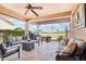 Outdoor patio space featuring fire pit, seating, and views of the golf course at 16165 W Vale Dr, Goodyear, AZ 85395