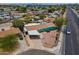 An aerial view showcases this charming home with its carport and proximity to the neighborhood street at 1637 W University Dr, Mesa, AZ 85201