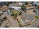An aerial view of the house and neighboring houses reveals a spacious backyard with a storage shed at 1637 W University Dr, Mesa, AZ 85201