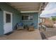 Quaint back patio with comfortable seating, perfect for enjoying the outdoors in a cozy setting with lots of shade at 1637 W University Dr, Mesa, AZ 85201