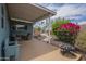 Relaxing back patio features comfortable seating, a fire pit, a barbecue, and colorful flowers for outdoor enjoyment at 1637 W University Dr, Mesa, AZ 85201