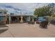 Expansive backyard featuring a covered patio, outdoor seating, a lush garden, and plenty of space for activities at 1637 W University Dr, Mesa, AZ 85201