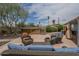 Backyard seating area with desert landscaping and a hot tub at 1637 W University Dr, Mesa, AZ 85201