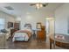 Bright bedroom with a wooden-framed bed and a vintage dresser at 1637 W University Dr, Mesa, AZ 85201