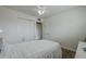 Bright bedroom with a ceiling fan and a spacious closet at 1637 W University Dr, Mesa, AZ 85201