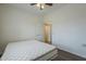 Bright bedroom features a ceiling fan and a comfortable bed with plush white mattress at 1637 W University Dr, Mesa, AZ 85201