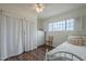 Charming bedroom featuring a well-lit window and wood floors at 1637 W University Dr, Mesa, AZ 85201