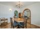 Inviting dining area with brick archway and stylish chandelier at 1637 W University Dr, Mesa, AZ 85201