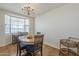 Charming dining room with wood table, seating for four, and natural light at 1637 W University Dr, Mesa, AZ 85201